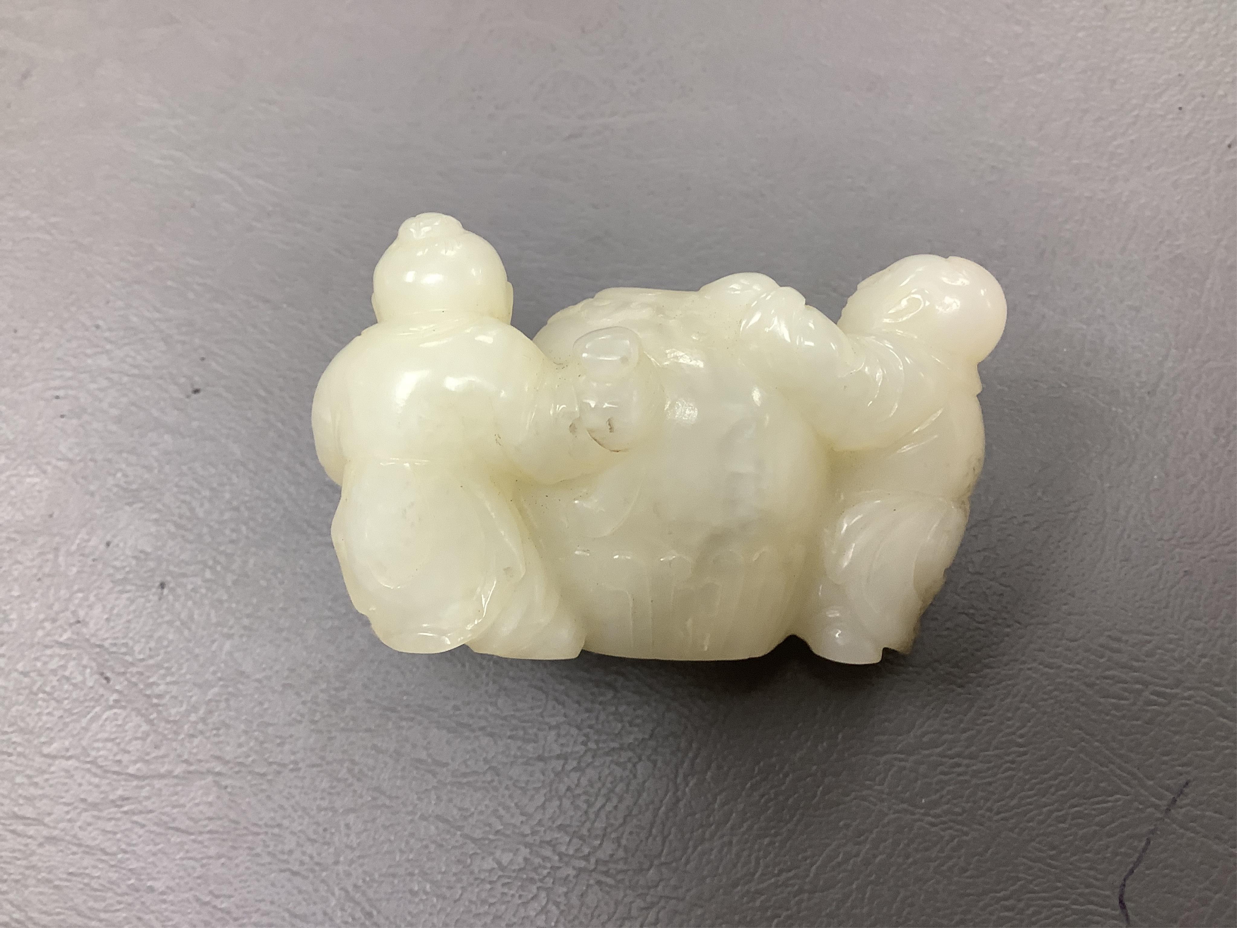 A Chinese white jade 'boys with jar' carving and three shoushan stone figures; luohan, girl with squirrel and mermaid (4), tallest 11cm